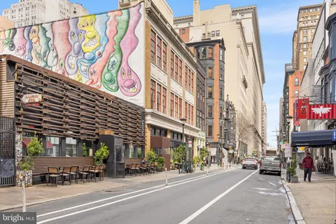 a city street lined with tall buildings