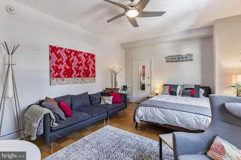 a living room with furniture and a rug