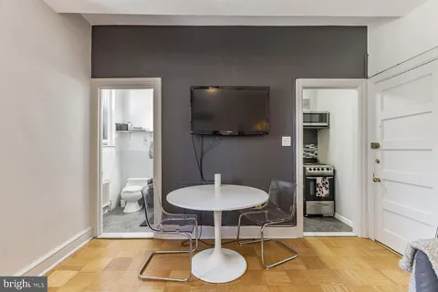 a room with a table and chairs