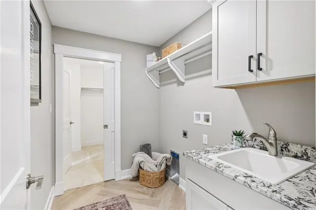 a spacious bathroom with a tub sink and mirror