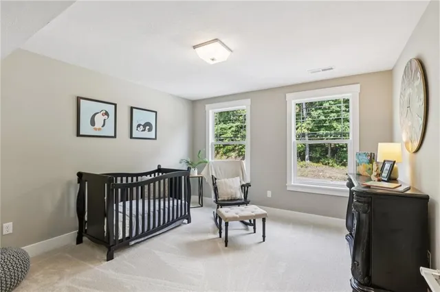 a bedroom with furniture and windows