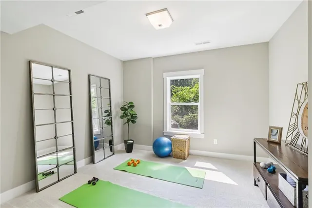a view of a livingroom with furniture and a window