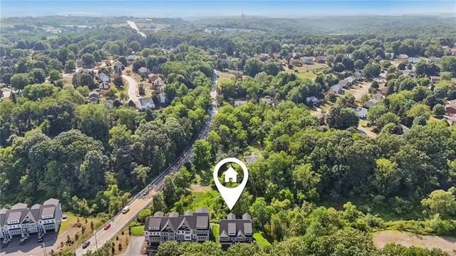 an aerial view of a house with a garden