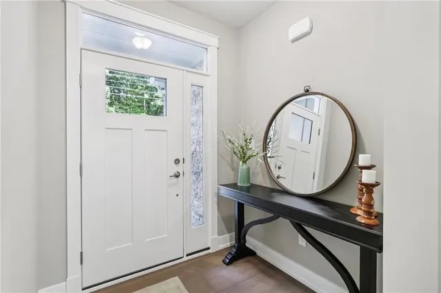 a view of a entryway with wooden floor