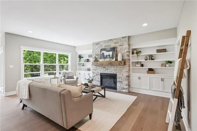 a living room with furniture and a fireplace