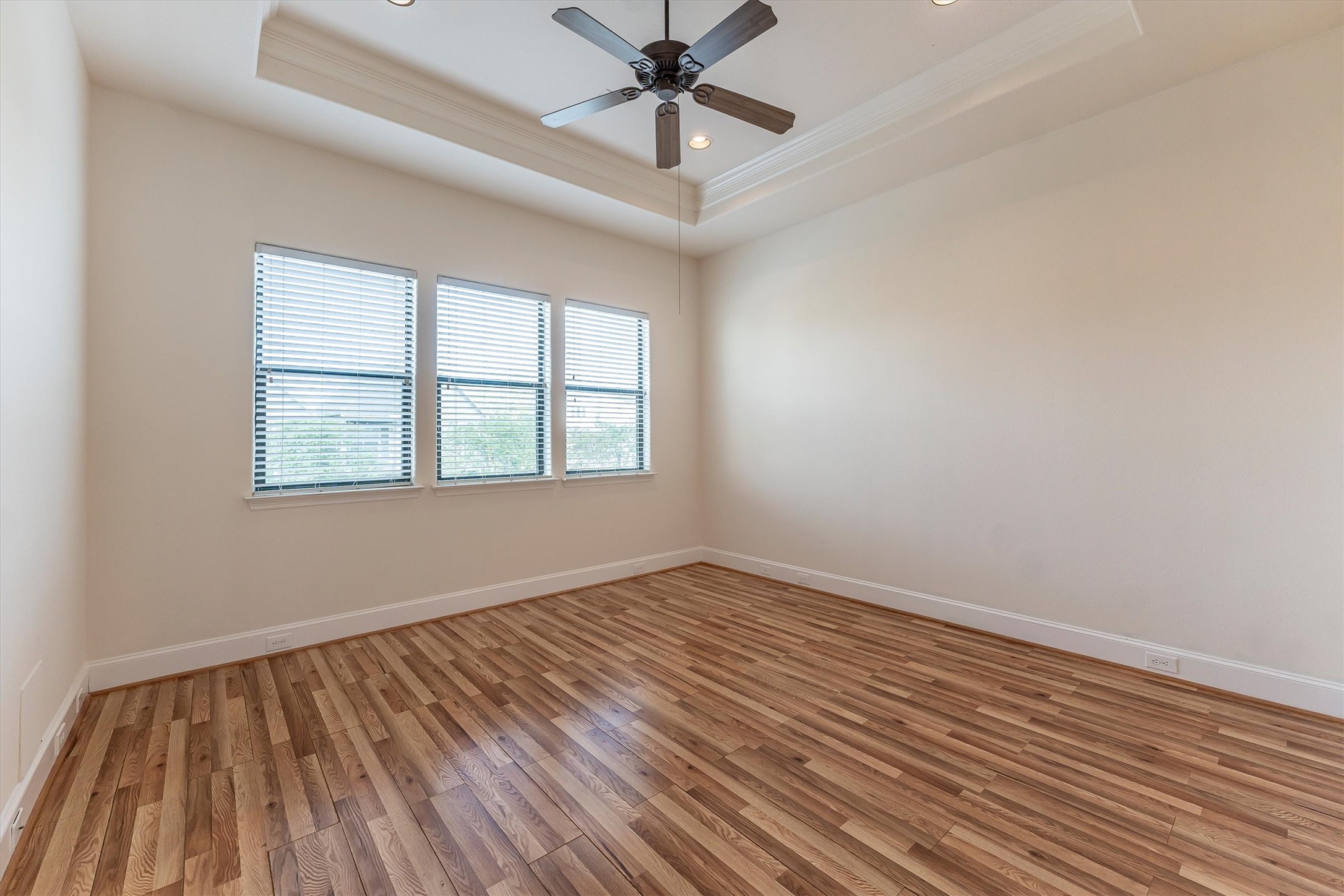 308 Grove Street Houston, TX 77020 - Photo 18 of 28 a view of an empty room with wooden floor and a window