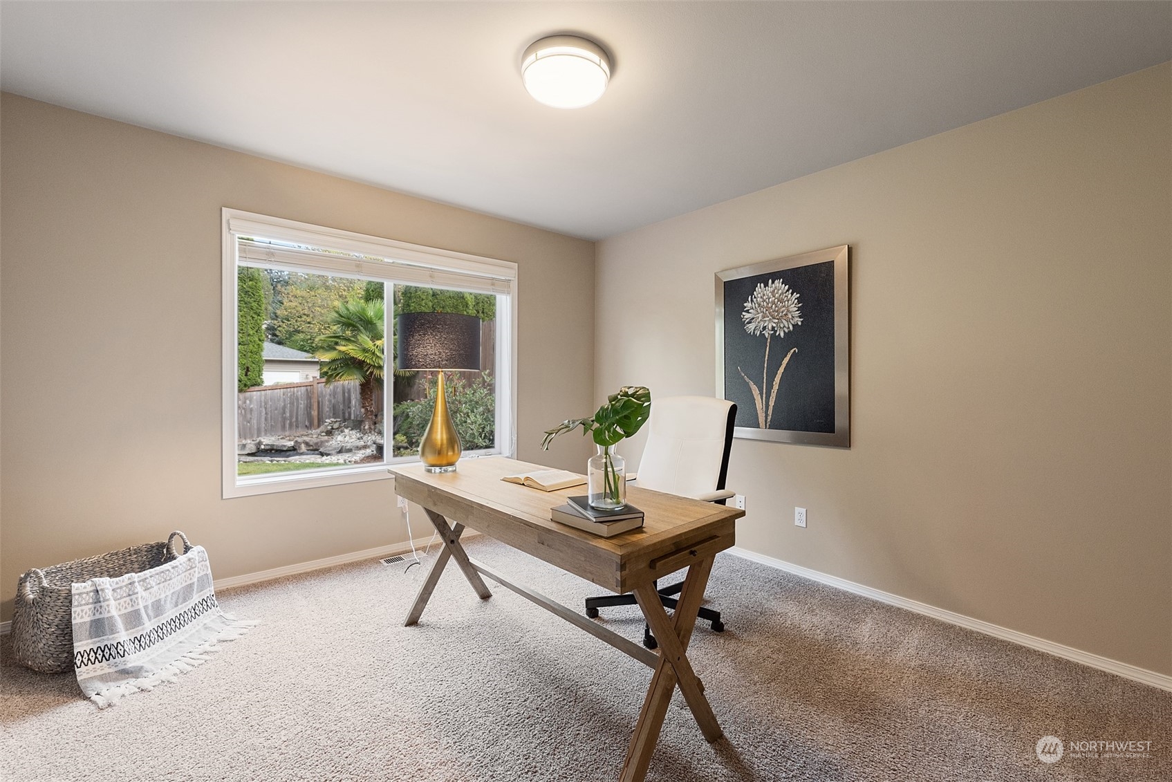 4411 240 Place Southeast Bothell, WA 98021 - Photo 17 of 36 a view of a workspace with furniture and a window