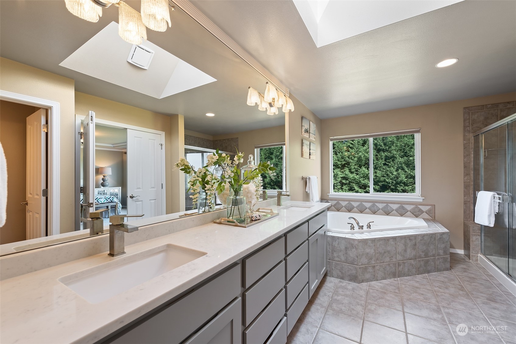4411 240 Place Southeast Bothell, WA 98021 - Photo 24 of 36 a bathroom with a tub sink and mirror