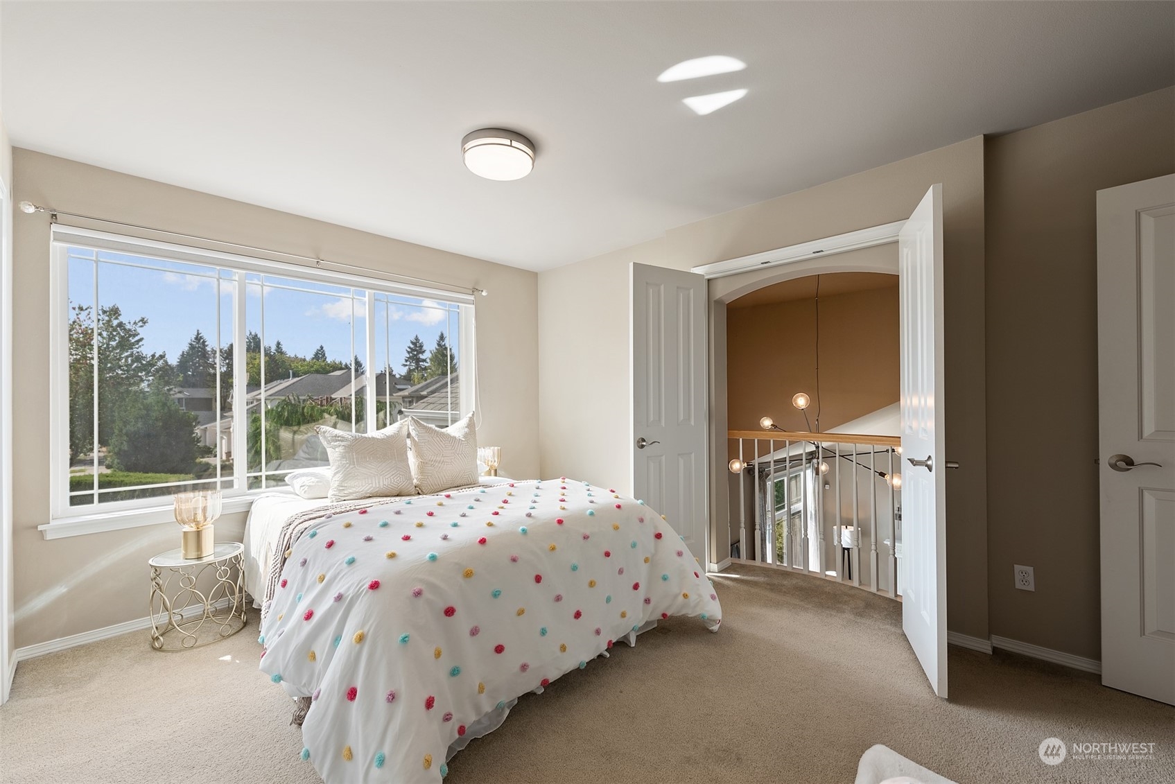 4411 240 Place Southeast Bothell, WA 98021 - Photo 27 of 36 a bedroom with a bed and large windows