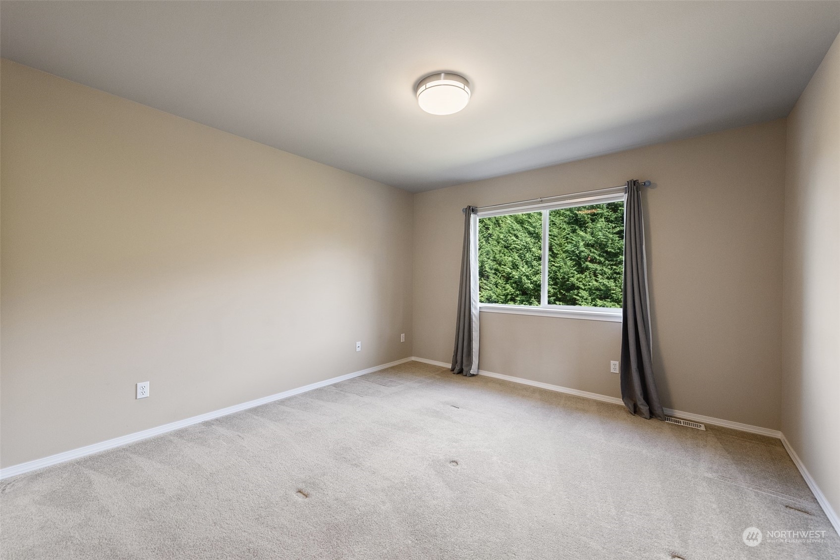 4411 240 Place Southeast Bothell, WA 98021 - Photo 31 of 36 an empty room with windows