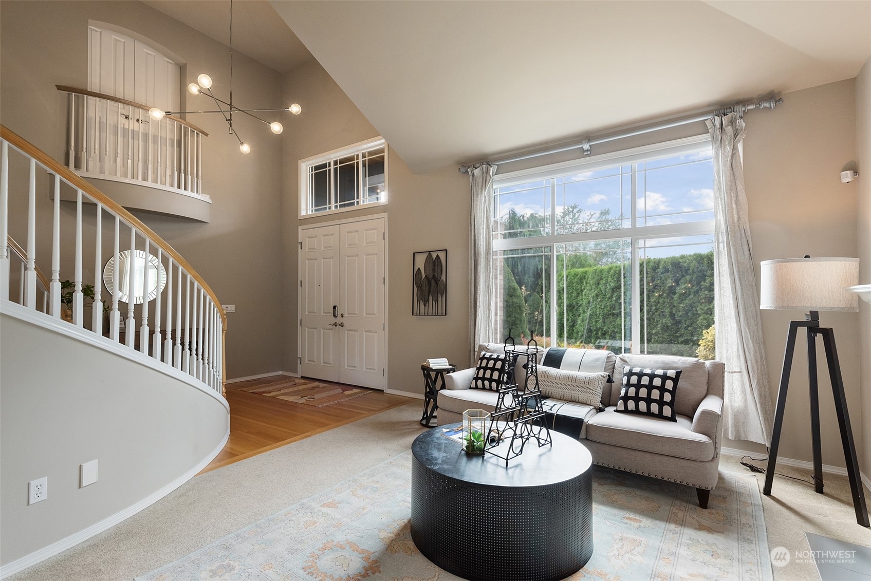 4411 240 Place Southeast Bothell, WA 98021 - Photo 6 of 36 a living room with furniture and a table