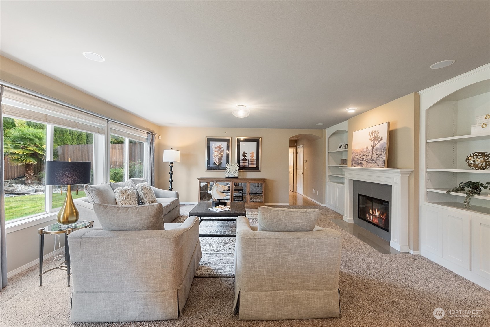 4411 240 Place Southeast Bothell, WA 98021 - Photo 9 of 36 a living room with furniture and a fireplace