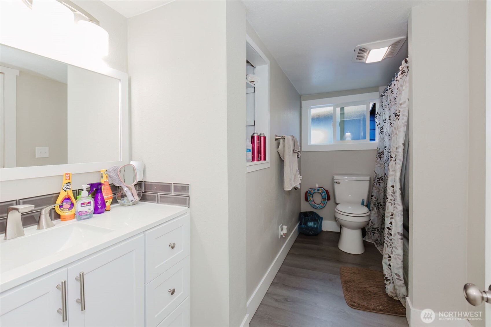 2824 Robin Avenue Bremerton, WA 98310 - Photo 14 of 31 a bathroom with a sink vanity mirror and toilet