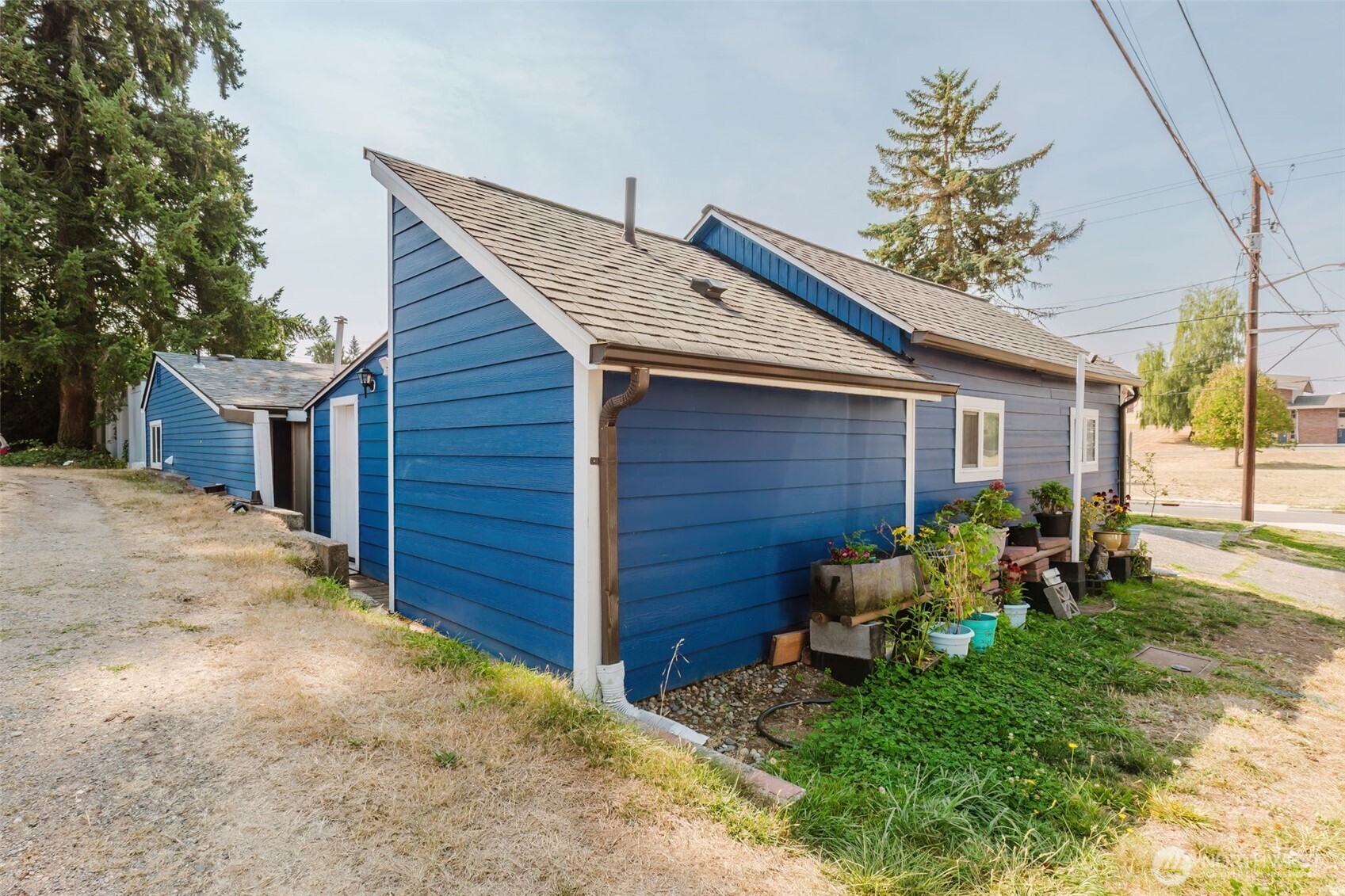 2824 Robin Avenue Bremerton, WA 98310 - Photo 16 of 31 a view of backyard with table and chairs and potted plants