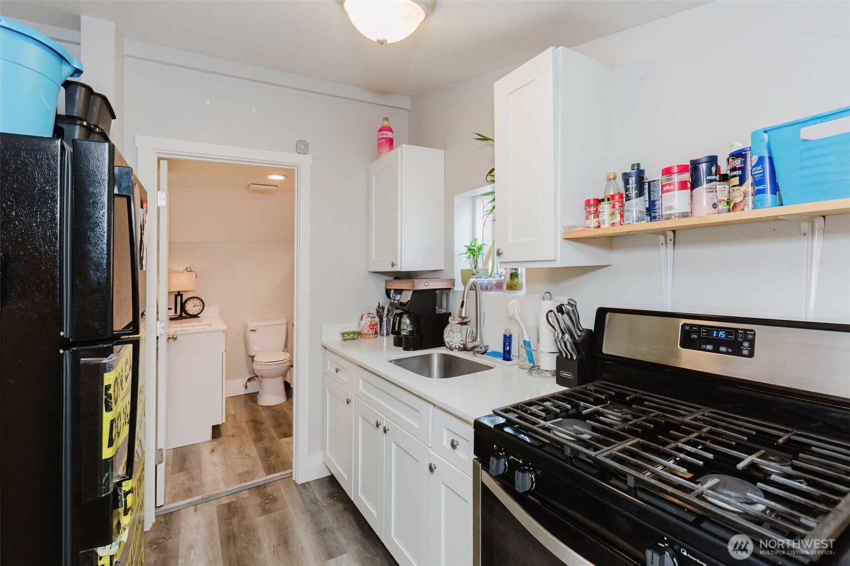 2824 Robin Avenue Bremerton, WA 98310 - Photo 19 of 31 a kitchen with a stove and a refrigerator