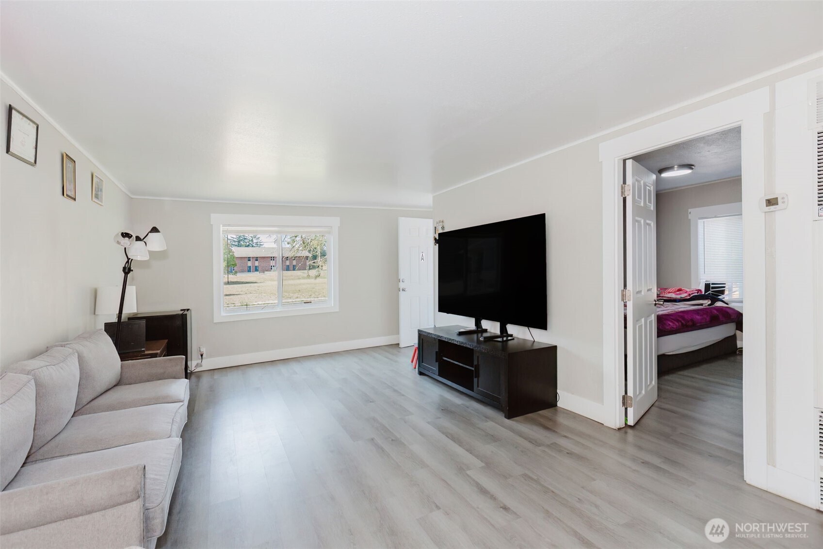 2824 Robin Avenue Bremerton, WA 98310 - Photo 6 of 31 a living room with furniture and a flat screen tv