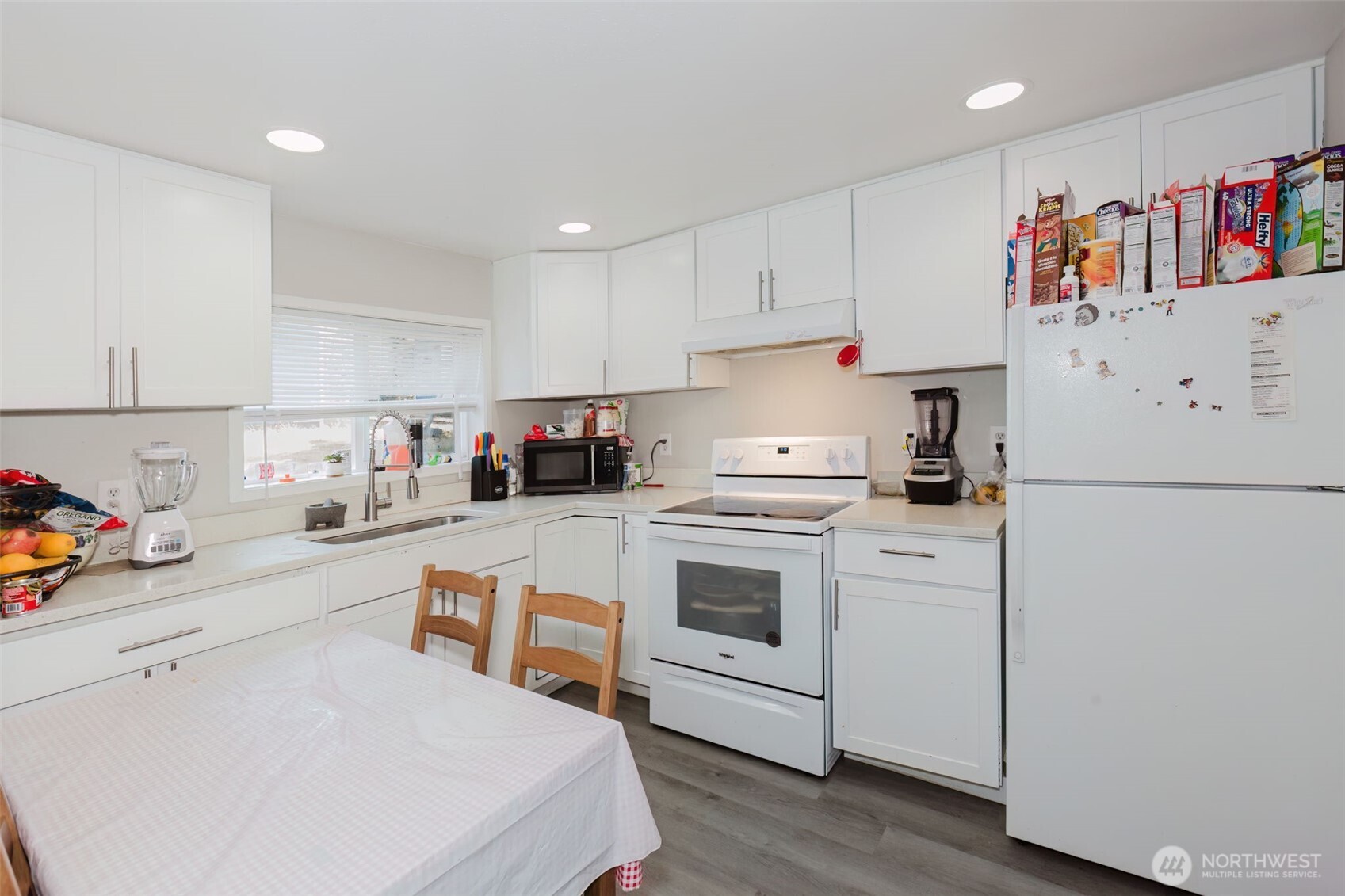2824 Robin Avenue Bremerton, WA 98310 - Photo 7 of 31 a kitchen with white cabinets and white appliances