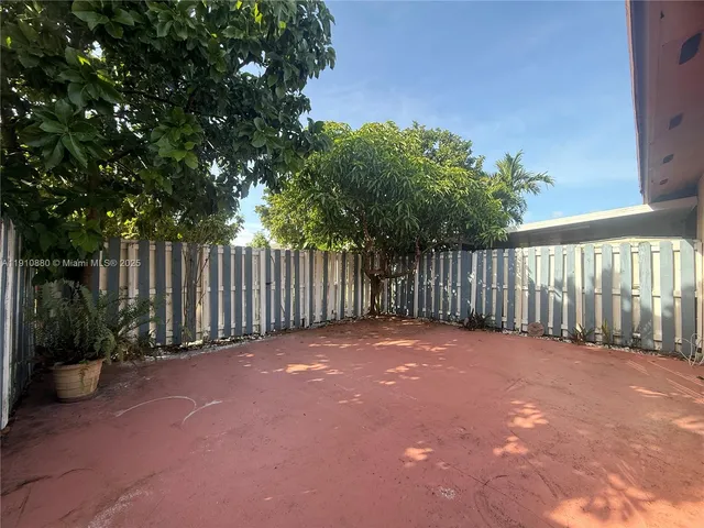 a view of a backyard with green space