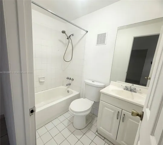 a bathroom with a sink a toilet and a bathtub