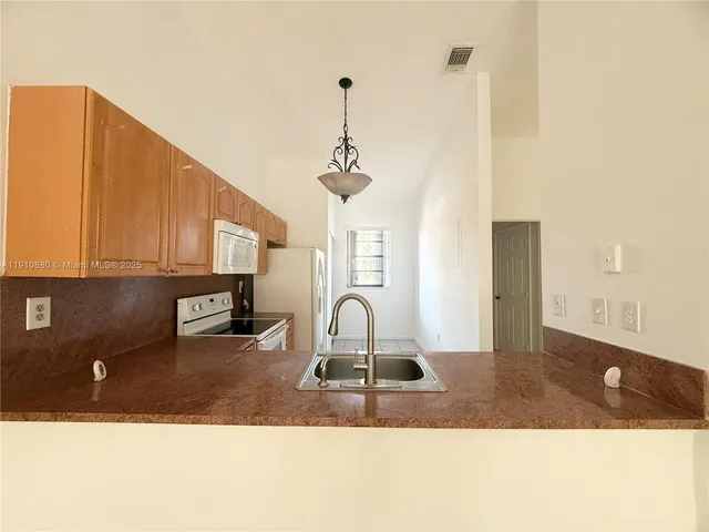 a picture of a living room with a sink