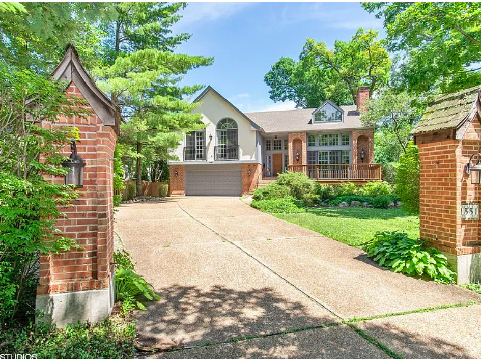 1551 Edgewood Road Lake Forest, IL 60045 - Photo 2 of 16 a front view of a house with a garden