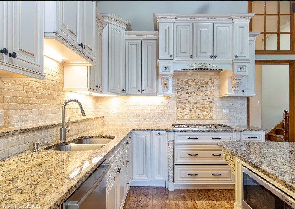 1551 Edgewood Road Lake Forest, IL 60045 - Photo 6 of 16 a kitchen with granite countertop a stove a sink and a microwave