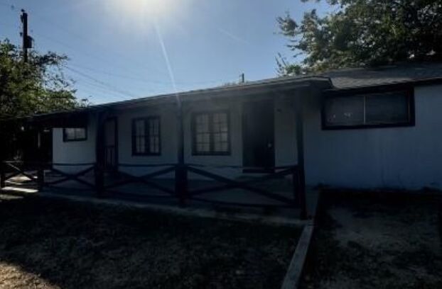 405 North Burleson Street, Unit A Kyle, TX 78640 - Photo 2 of 8 a backyard of a house