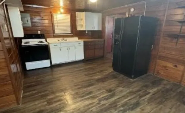 a kitchen with stainless steel appliances a refrigerator sink and stove