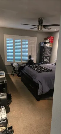 a bedroom with bed and window