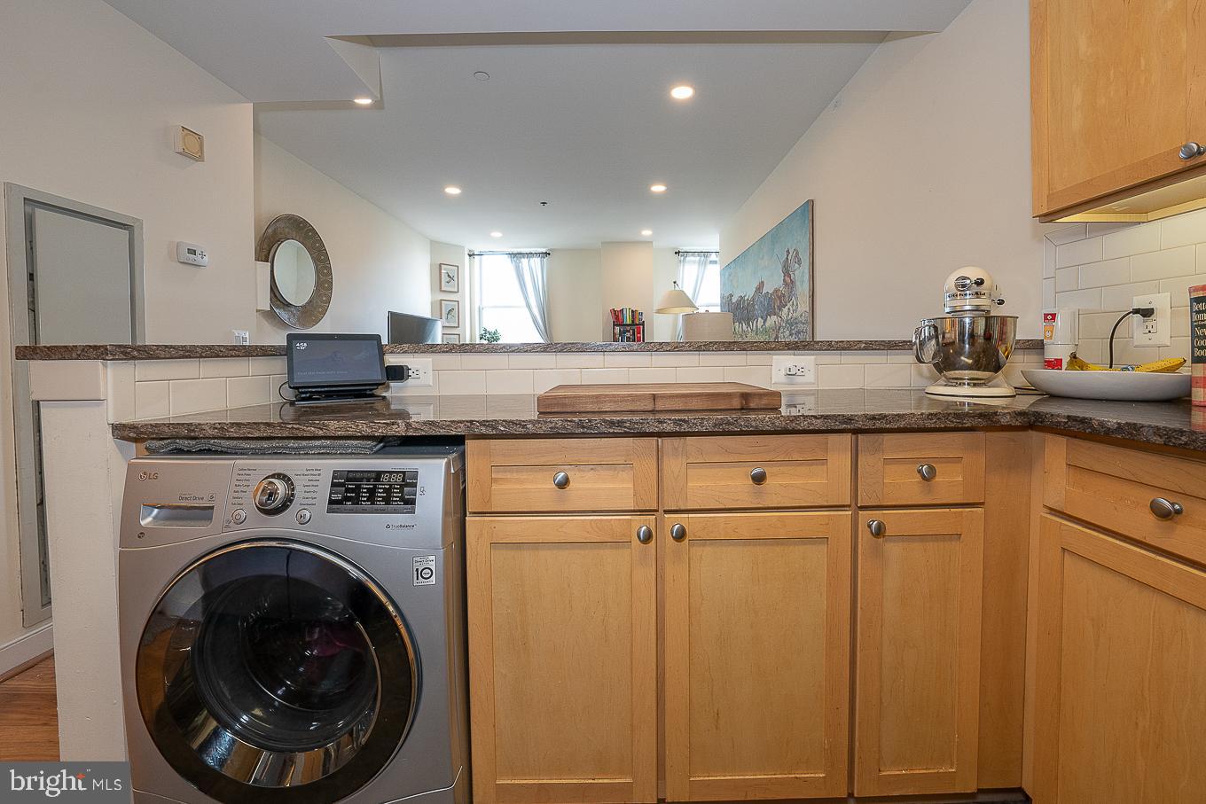 111 South 15th Street, Unit 2001 Philadelphia, PA 19102 - Photo 6 of 17 a kitchen with granite countertop a sink a stove and cabinets