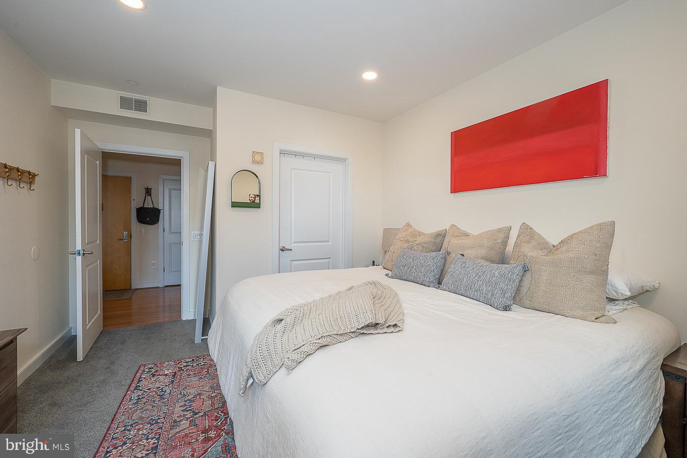 111 South 15th Street, Unit 2001 Philadelphia, PA 19102 - Photo 10 of 17 a spacious bedroom with a bed and a couch