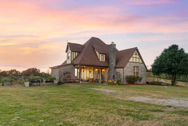 a view of large house with a big yard