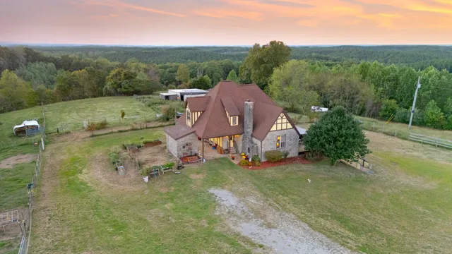 a view of a porch with furniture and wooden floor