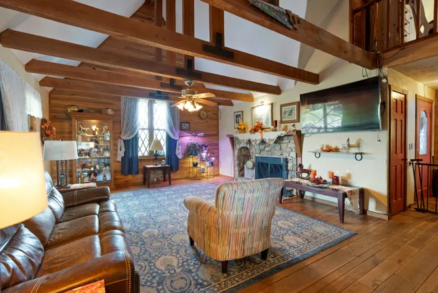 a living room with furniture and a flat screen tv