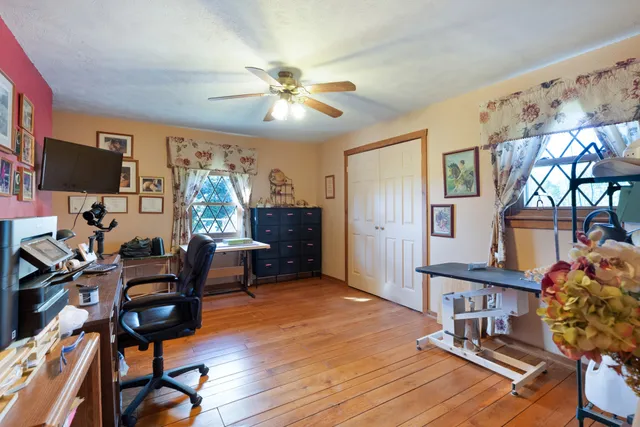 a bathroom with a sink mirror and toilet