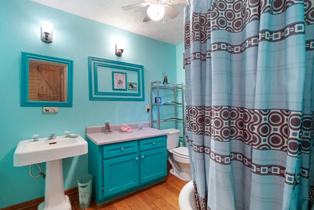 a view of staircase with railing and a window