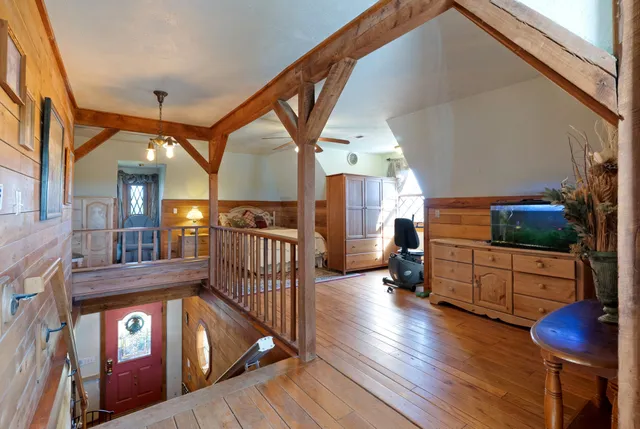 a view of balcony with wooden floor and outdoor seating