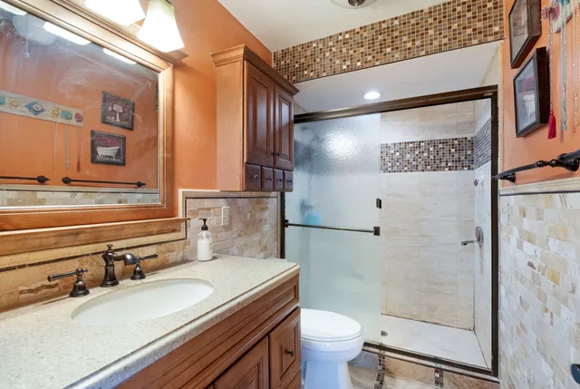 a view of a lake with green field