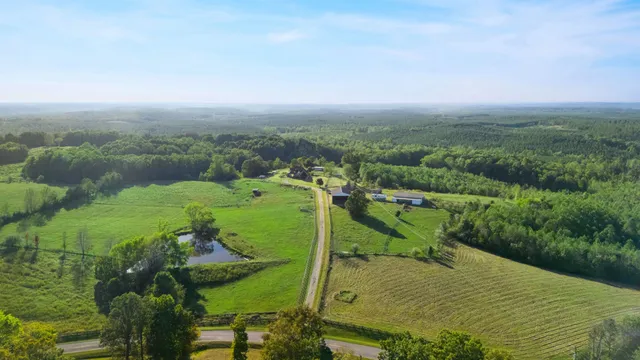 an aerial view of a house with outdoor space