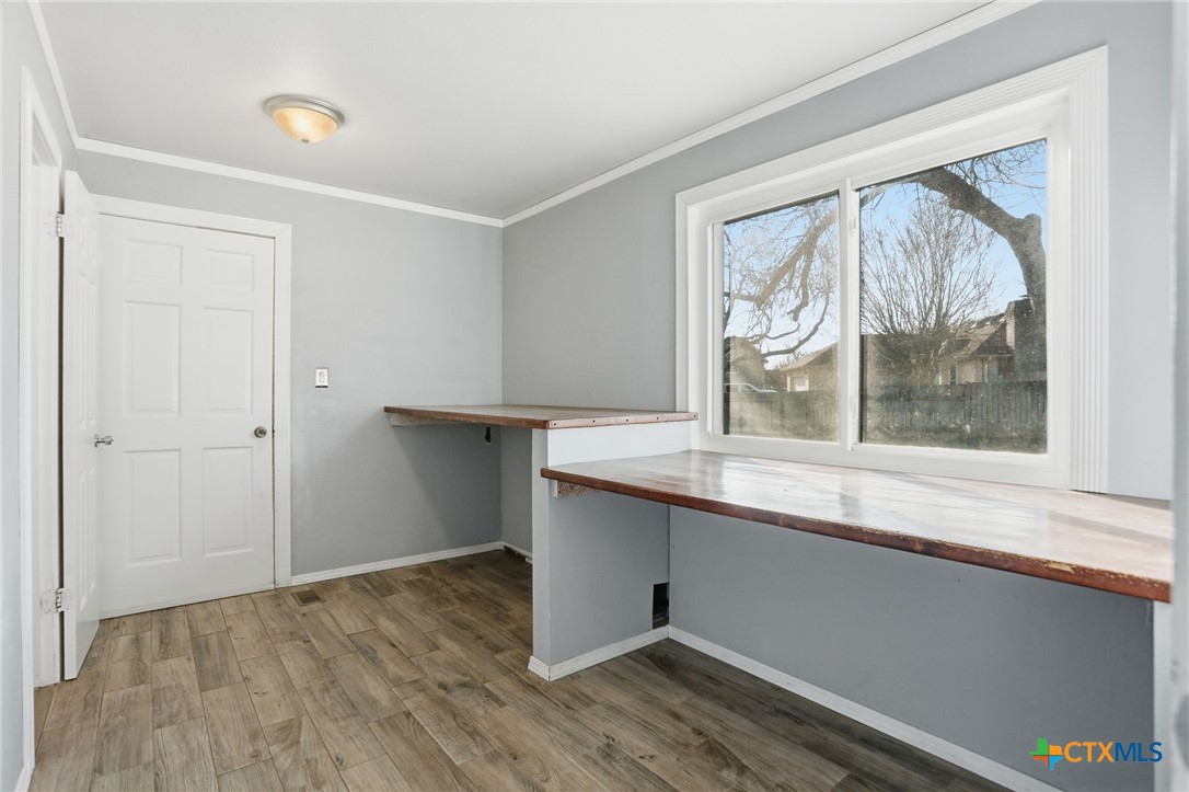 119 Primrose Drive Kyle, TX 78640 - Photo 26 of 30 a room with a wooden floor and a window