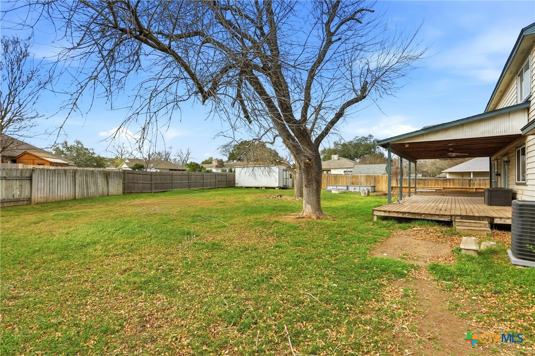 119 Primrose Drive Kyle, TX 78640 - Photo 28 of 30 a view of a patio with a yard
