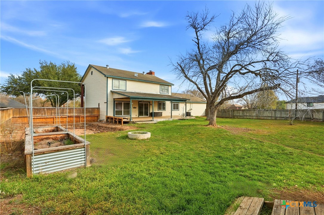 119 Primrose Drive Kyle, TX 78640 - Photo 29 of 30 a swimming pool with outdoor seating and yard
