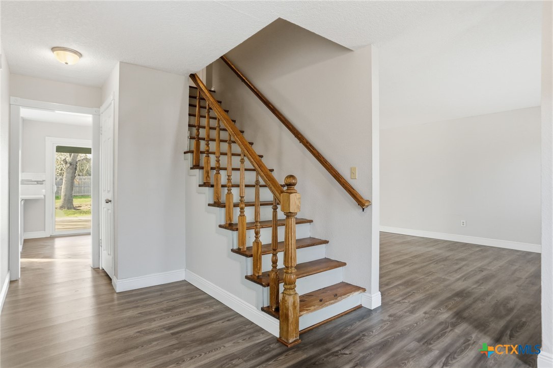 119 Primrose Drive Kyle, TX 78640 - Photo 4 of 30 a view of entryway with wooden floor