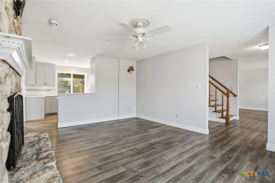 119 Primrose Drive Kyle, TX 78640 - Photo 7 of 30 wooden floor in an empty room with a window