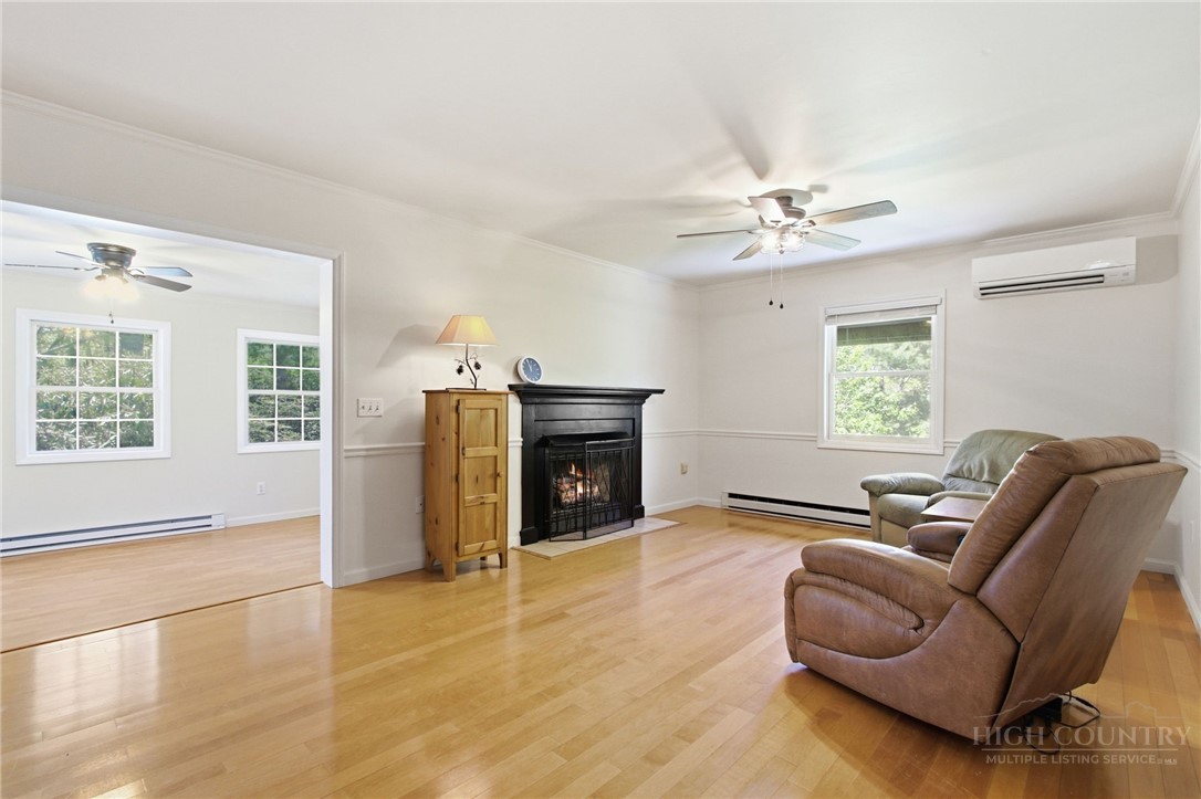 164 Rocky Meadows Road Newland, NC 28657 - Photo 12 of 49 a living room with furniture and a fireplace