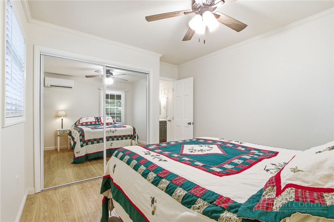164 Rocky Meadows Road Newland, NC 28657 - Photo 19 of 49 a bedroom with a bed and a chandelier