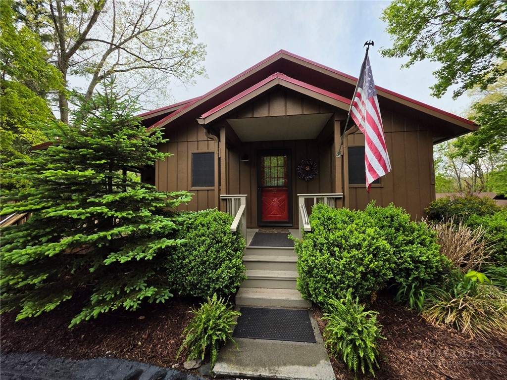 164 Rocky Meadows Road Newland, NC 28657 - Photo 2 of 49 a front view of a house with plants