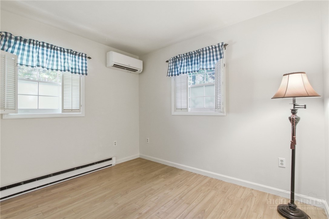 164 Rocky Meadows Road Newland, NC 28657 - Photo 21 of 49 an empty room with a window