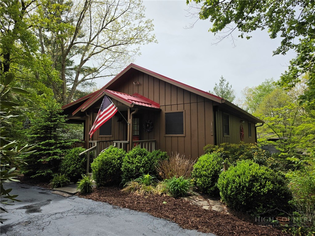 164 Rocky Meadows Road Newland, NC 28657 - Photo 3 of 49 a front view of a house with garden