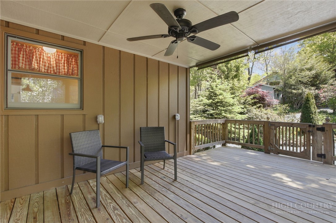 164 Rocky Meadows Road Newland, NC 28657 - Photo 34 of 49 a view of a porch with wooden floor and furniture